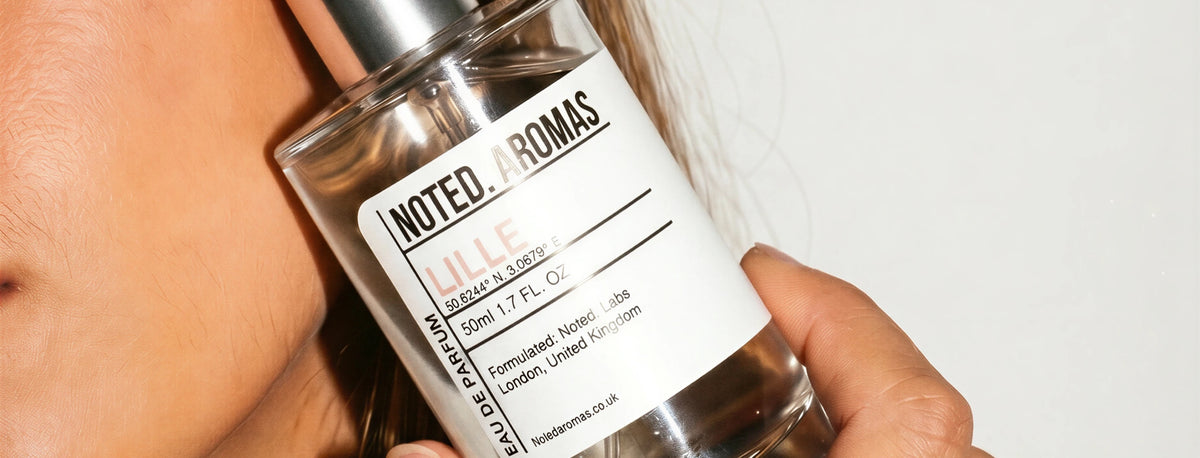 Noted Aromas hero (desktop) — model holding Lille eau de parfum